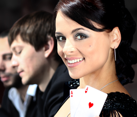 A lady holding playing cards two aces